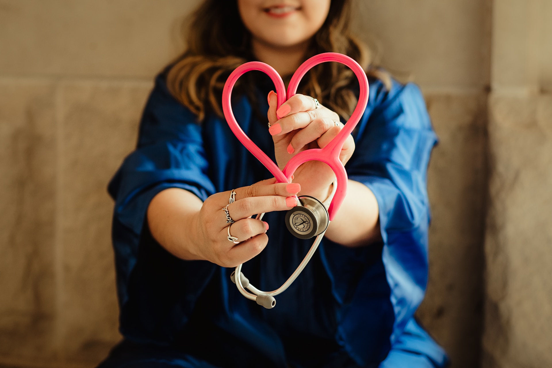 woman holding stethoscope