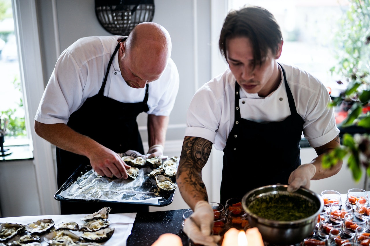 Two guys cooking